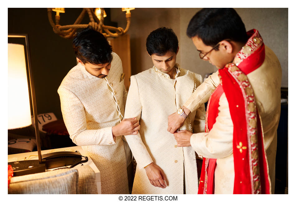 Groomsmen helping Neal who is having a traditional Hindu Bengali Wedding which is similar to other south asian weddings especially from India.Wedding at Hyatt Regency, Chesapeake Bay, Cambridge