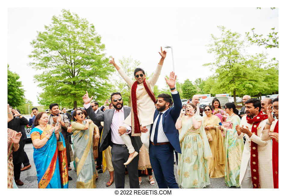 Groomsmen pick up the groom while the Wedding guests dancing at the Baraat, Groom’s wedding procession before the Hindu Bengali Ceremony at the Hyatt Regency, Chesapeake Bay, Cambridge Maryland