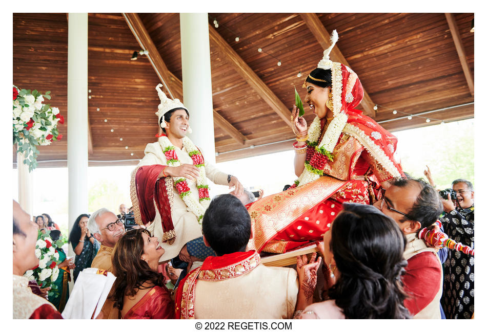 Bride and groom compete to put the garlands on each other while guests pick them up. Bengali Wedding Traditions.