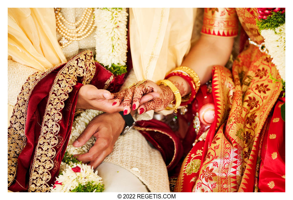 Bride and Groom holding hands at their traditional Hindu Wedding