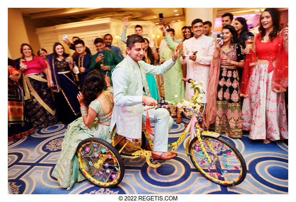 Groom entering the sangeet with his bride on a rickshaw
