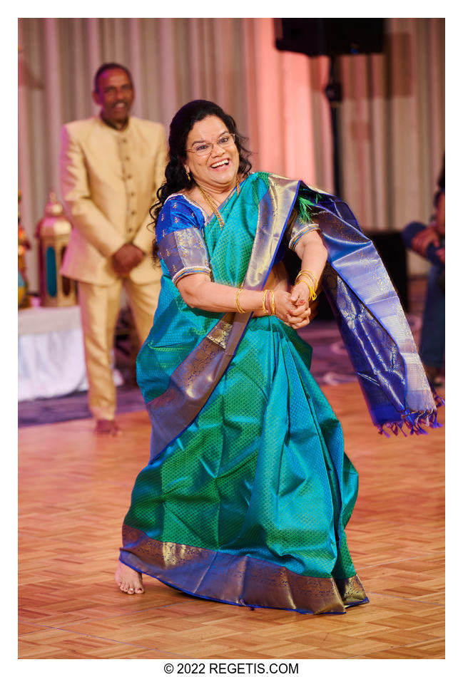 Mother of the groom performing a dance at the Indian Sangeet