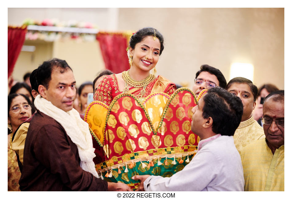 Telugu bride arriving at her traditional Hindi wedding ceremony.