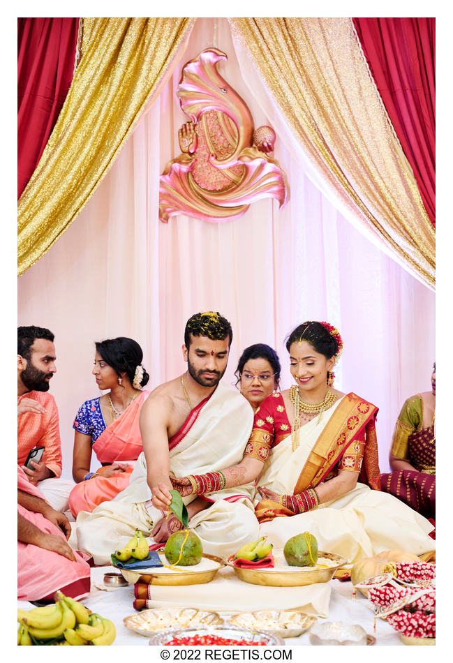 The bride and groom perform their Hindu rituals at their traditional wedding ceremony.