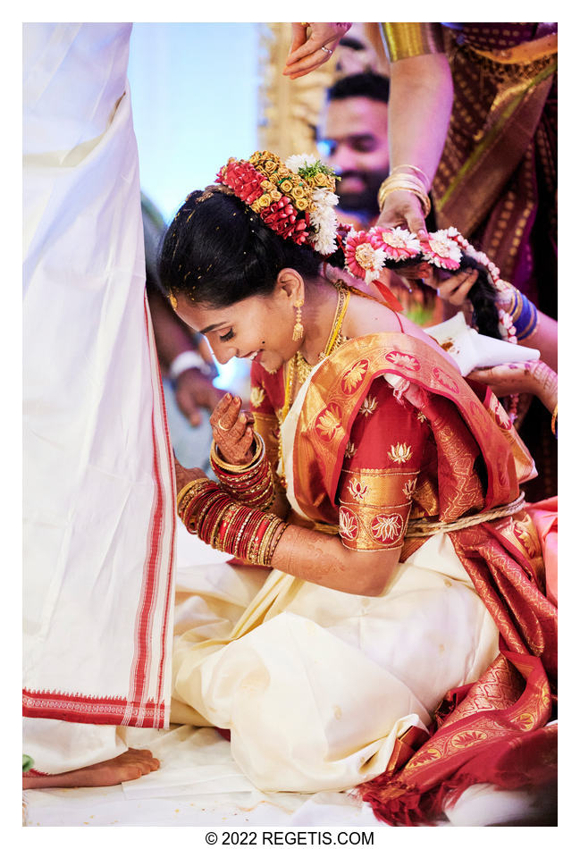 The bride and groom perform their Hindu rituals at their traditional wedding ceremony.