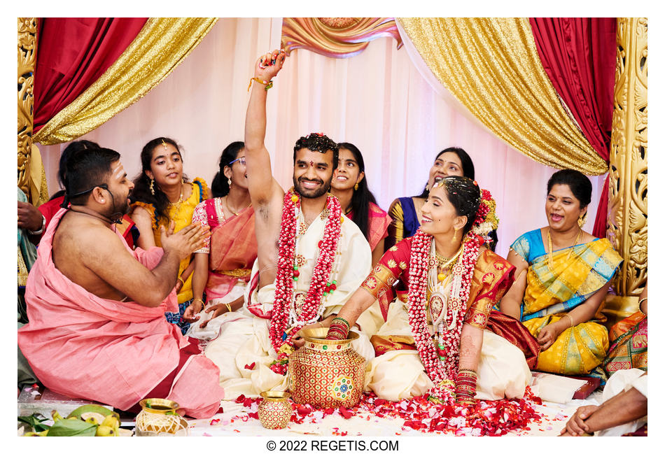 The bride and groom play traditional games at their Telugu wedding ceremony at traditional Telugu wedding.
