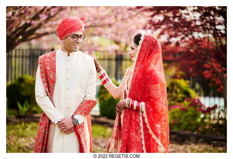 Indian bride and groom seeing each other for the first time in their wedding outfits