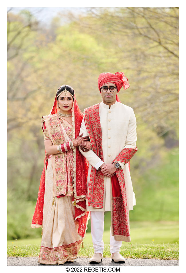 A standard portrait of bride and groom in their Indian outfits before their wedding