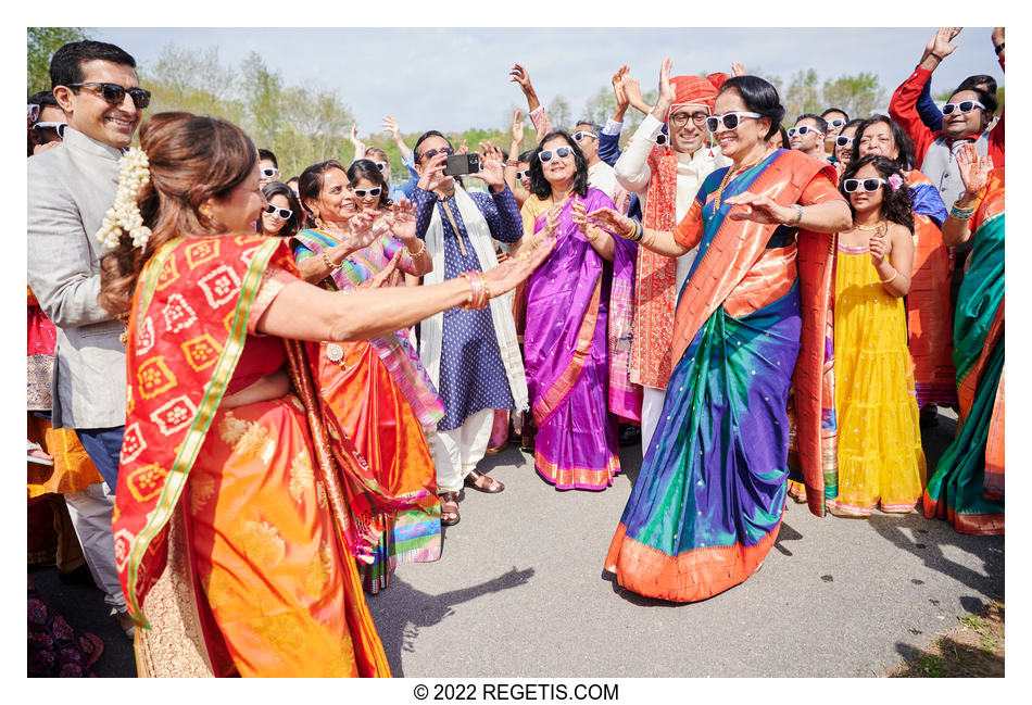 Beautiful women in their colorful sarees dancing at the South Asian Wedding baraat
