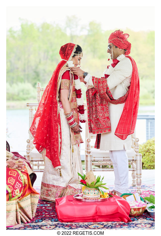 Bride and Groom exchange garlands at their Indian Wedding