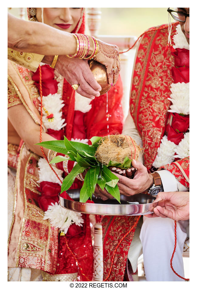A beautiful and important detail of kanyadaan being performed by the parents of the bride. This is one of the most important ritual at any Hindu Ceremony