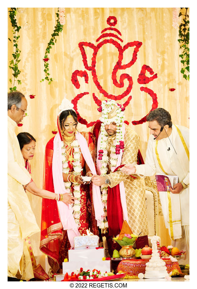 Tripali and Nitin performing the Hindu wedding rituals at their South Asian Wedding at the Conrad Hotel Washington