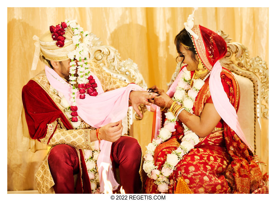Tripali and Nitin exchange rings at their South Asian Wedding at the Conrad Hotel Washington