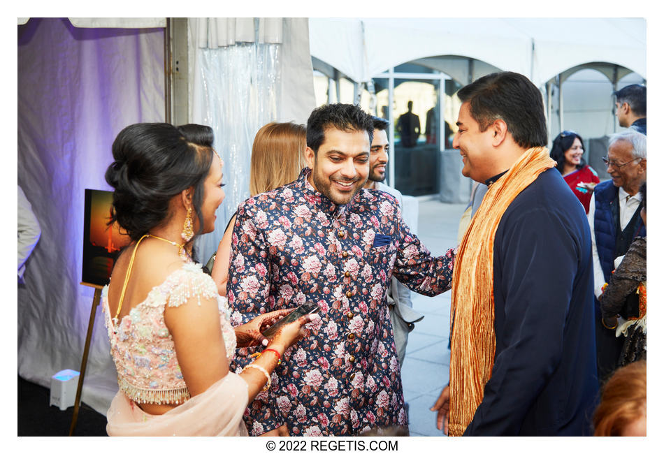 Guests interacting at Tripali and Nitin’s Sangeet ceremony at 101 Constitution AVE