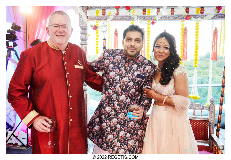 Tripali and Nitin’s getting a photo with one of their guests at their Sangeet ceremony at 101 Constitution AVE